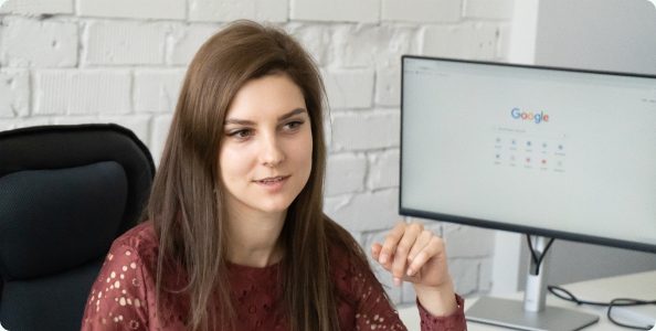 A team member at her desk in the Riga office